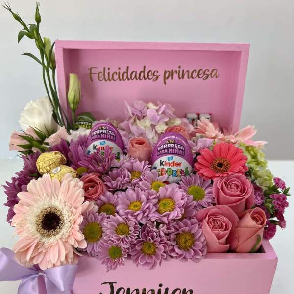Pink gift box arrangement with roses, daisies, and chocolates