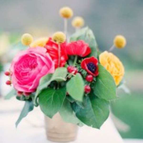 Small bouquet of colorful flowers in a wrapped container