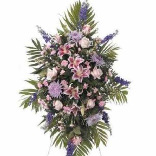Standing floral spray with pink lilies and purple flowers