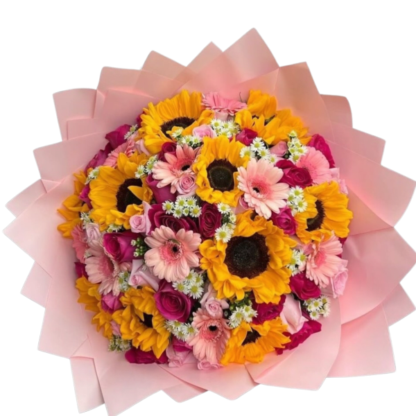 Bouquet of sunflowers, pink gerbera daisies, and roses wrapped in pale pink paper