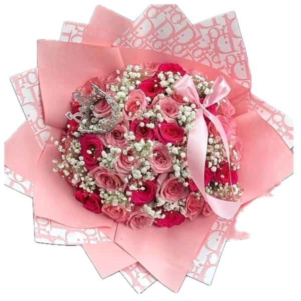 Pink rose bouquet with baby's breath, ribbon, and decorative wrapping