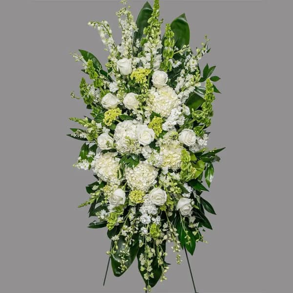 Tall white floral standing spray with roses and hydrangeas