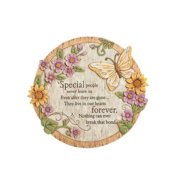 Round wooden memorial plaque with flowers, butterfly, and sympathy text