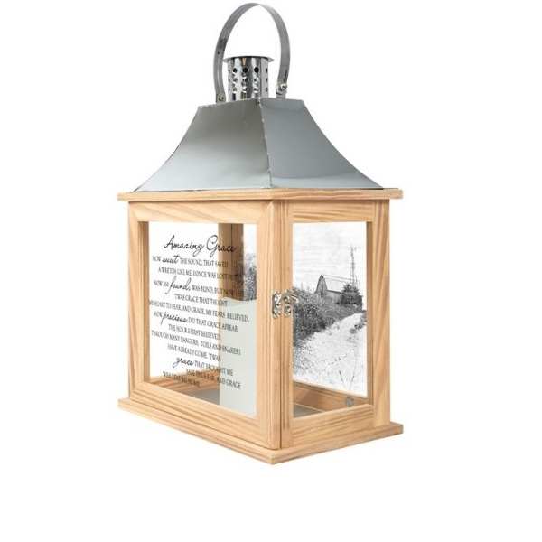 Wooden lantern with a metal top and printed glass panels