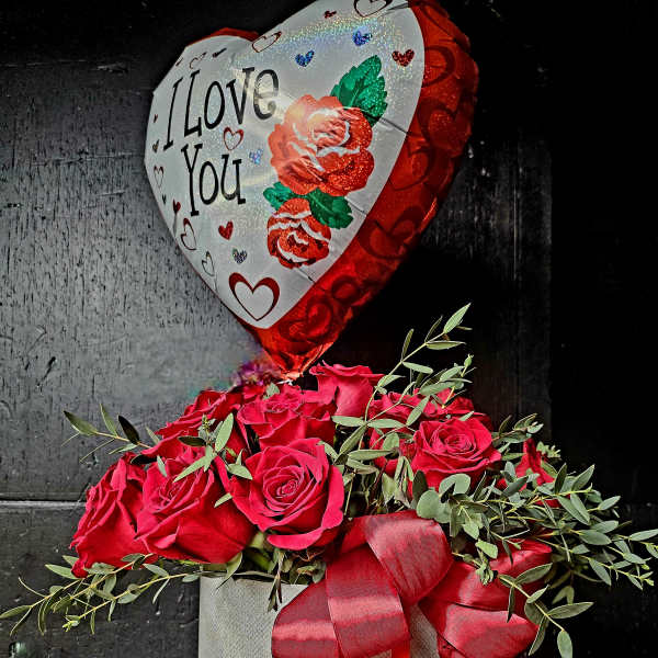 Red rose arrangement in a gray box with a heart-shaped "I Love You" balloon