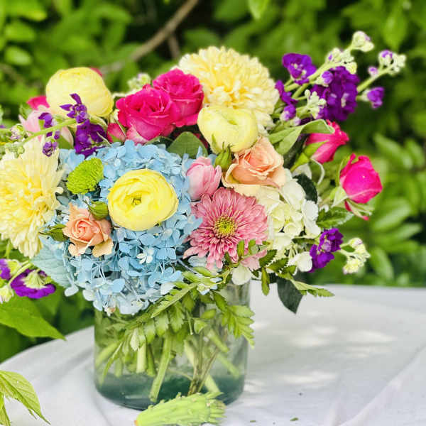 Colorful mixed bouquet in a clear glass vase