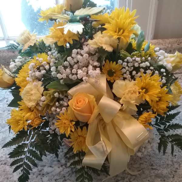 Yellow and cream floral bouquet with a satin ribbon bow
