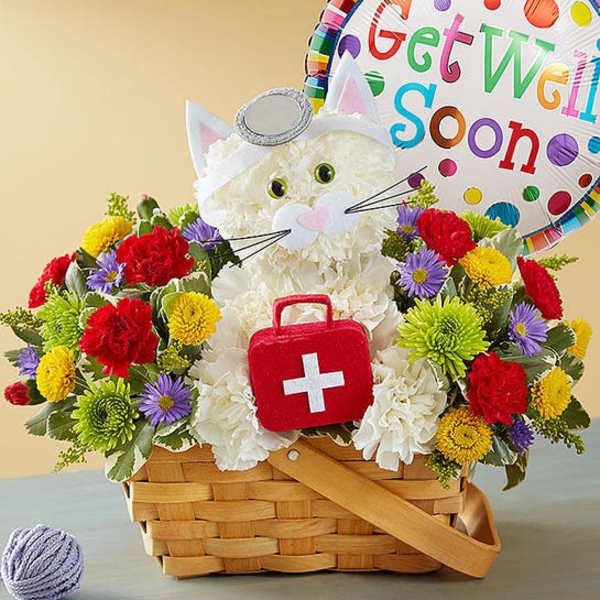 Basket of colorful flowers with a cat-shaped plush and a get well soon balloon