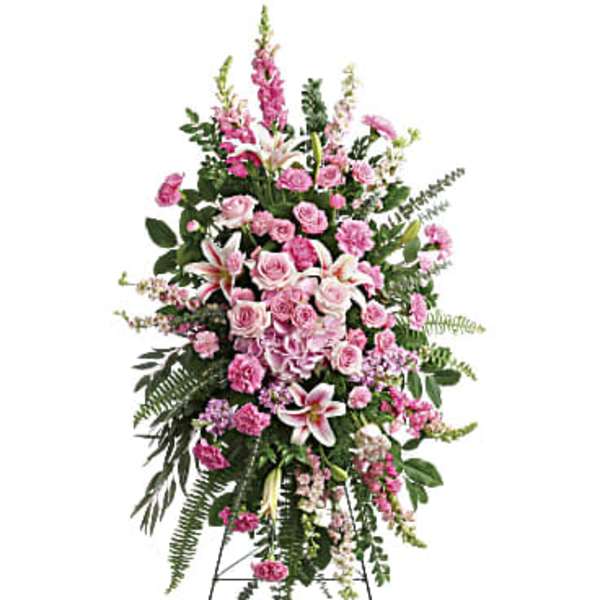 Tall pink floral standing spray on an easel