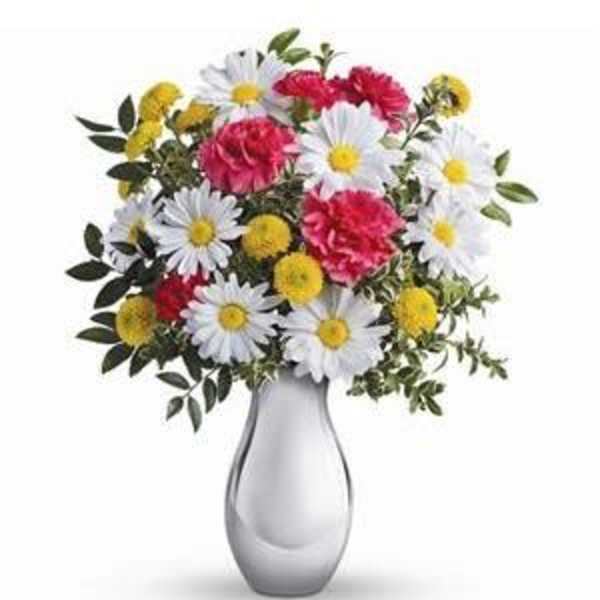 Bouquet of white daisies, pink carnations, and yellow pompons in a gray vase