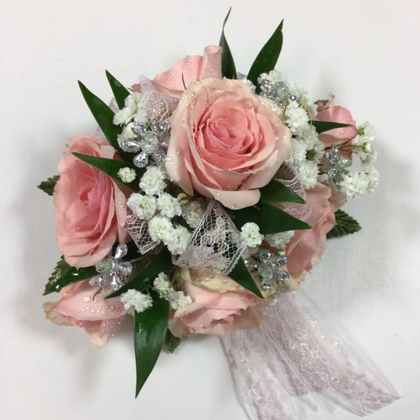 Pink rose bouquet with white filler flowers and lace ribbon