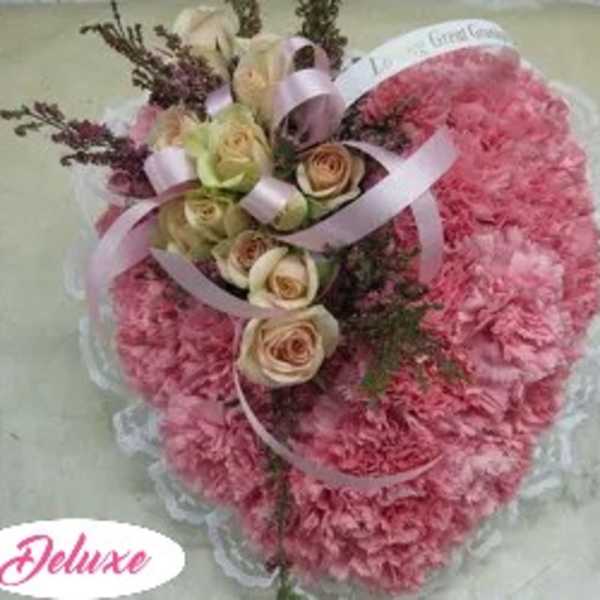 Pink carnation bouquet with cream roses and ribbon