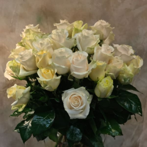 Bouquet of white roses in a glass vase