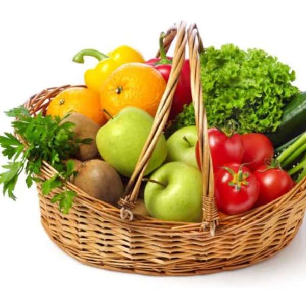 Wicker basket filled with assorted fruit and vegetables