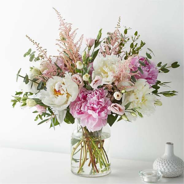 Pink and white mixed bouquet in a clear glass vase