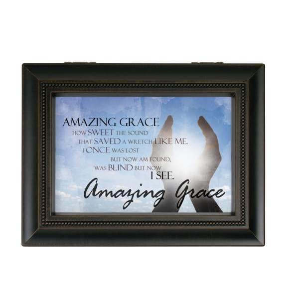 Framed wall art with the words Amazing Grace and raised hands