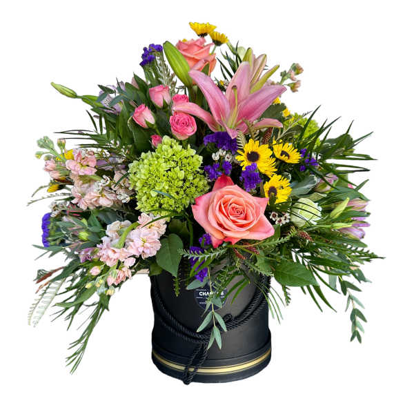 Mixed bouquet with pink roses, lilies, and yellow daisies in a black hatbox