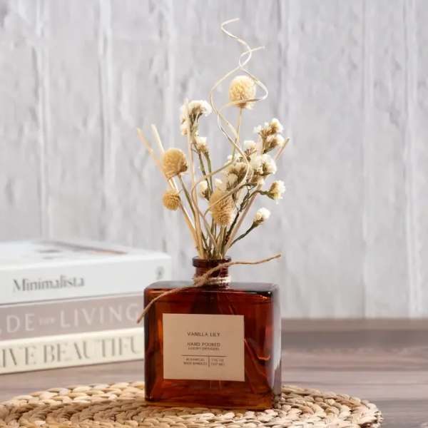 Dried flowers in an amber glass bottle with a twine tie