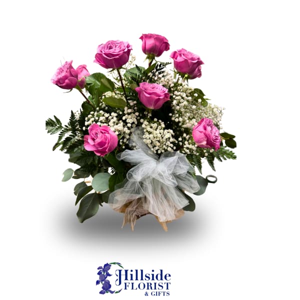 Pink roses with baby's breath and a tulle bow