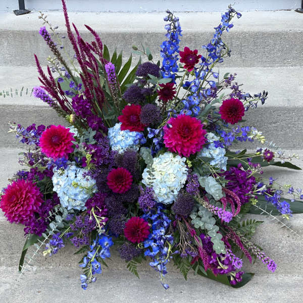 Large bouquet of blue, purple, and pink flowers