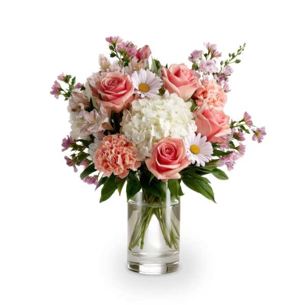 Pink roses and white flowers arranged in a clear glass vase