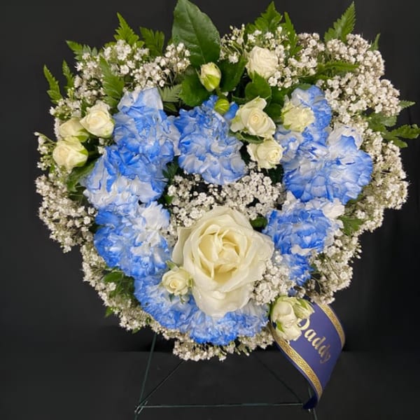 Blue and white floral wreath with roses and baby's breath