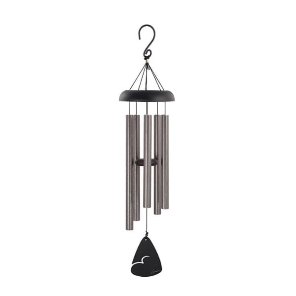 Black and silver wind chime hanging on a white background