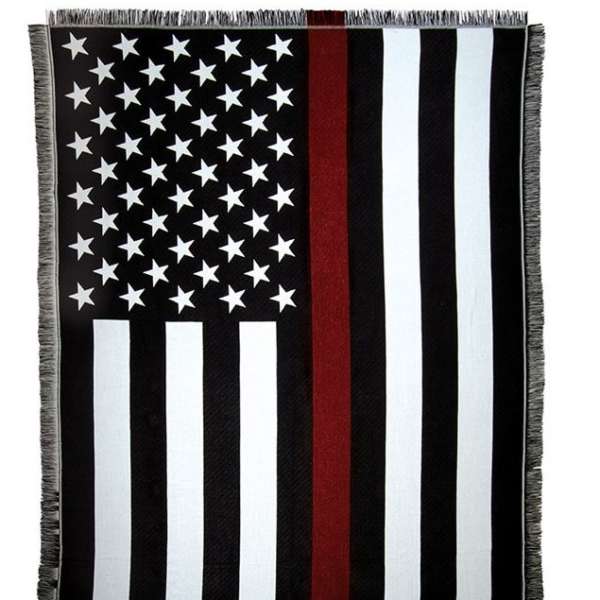 Black-and-white American flag blanket with a red stripe and fringe