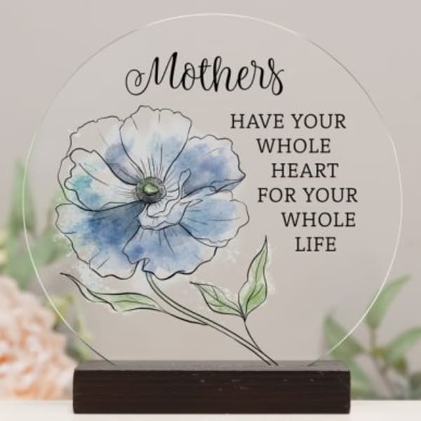Round glass plaque with a blue flower illustration and Mother's quote