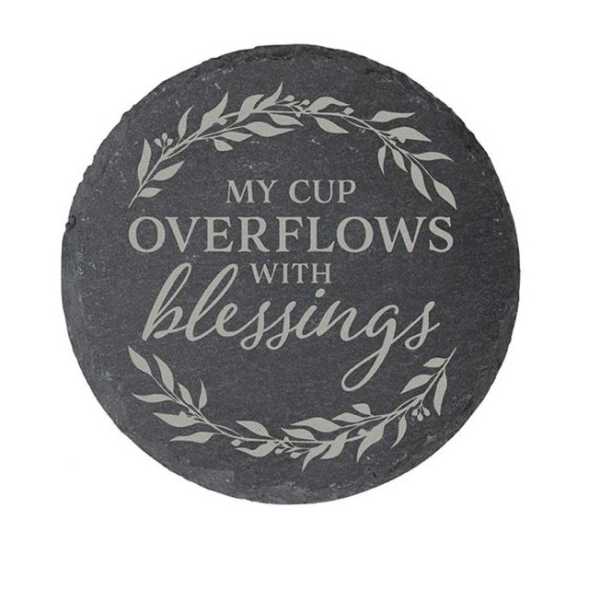 Round black stone plaque with the words "My cup overflows with blessings"