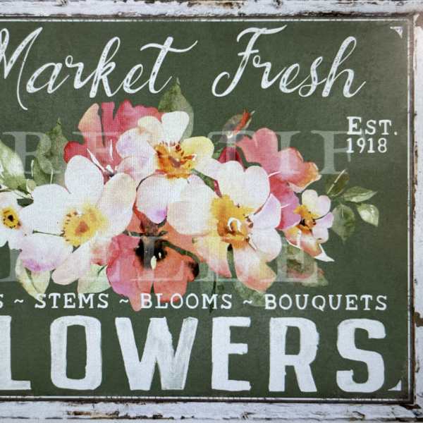 Floral shop sign with painted pink and white flowers on a green background