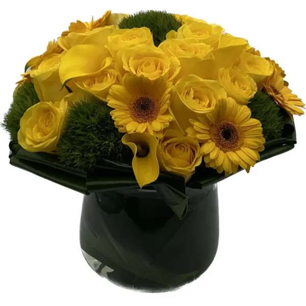Yellow roses and gerbera daisies in a dark vase