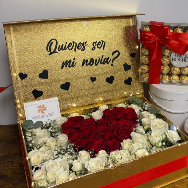 Gold gift box with red and white roses and a Ferrero Rocher box