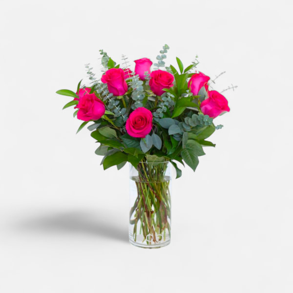 Bouquet of hot pink roses in a clear glass vase