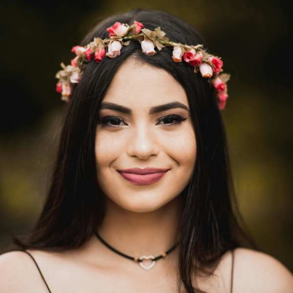 Woman wearing a pink and white flower crown