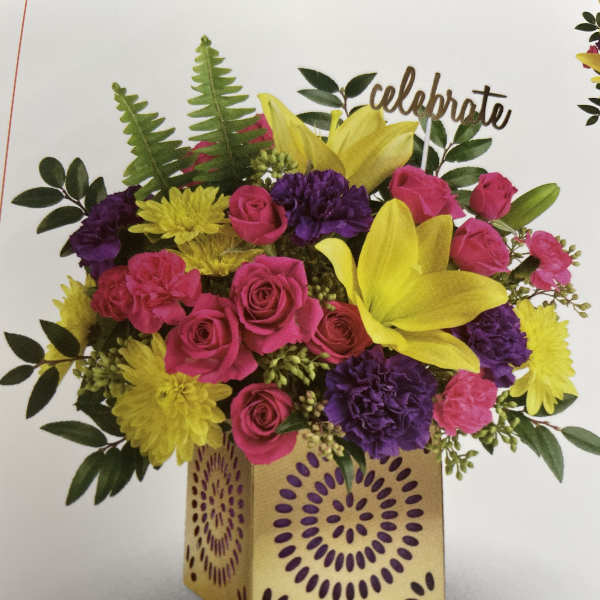 Bright mixed bouquet in a decorative square box with a "celebrate" topper.