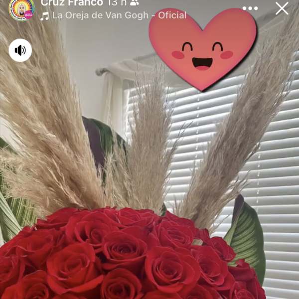 Large bouquet of red roses with tall beige pampas grass