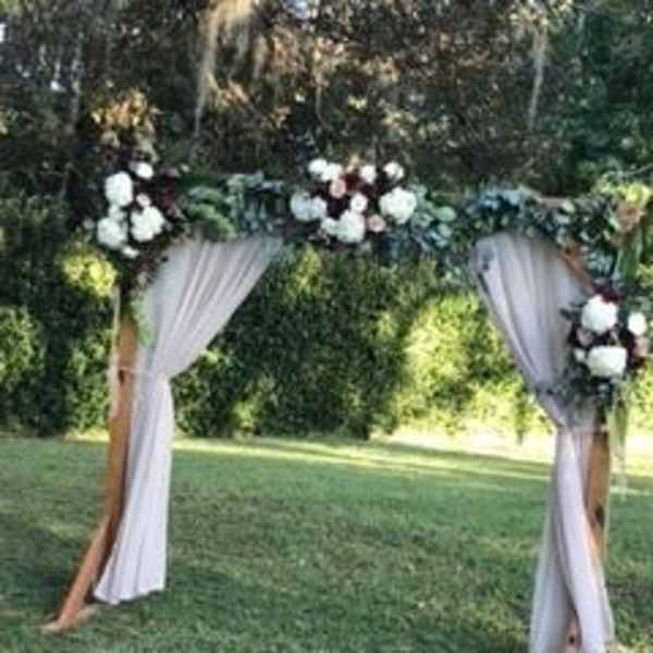 Wooden Arch with Flowers and Greenery Garland