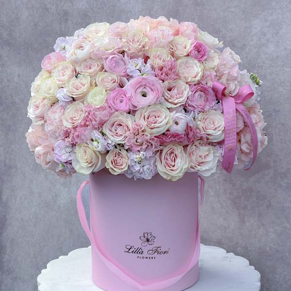 Large pink and white rose bouquet in a pink hat box