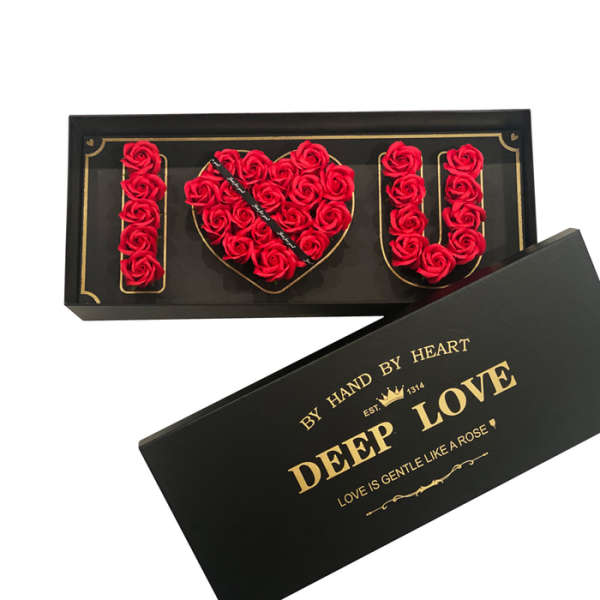 Black gift box with red rose I heart U arrangement and gold lettering on the lid