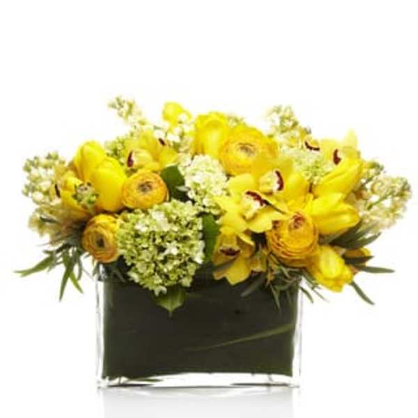 Yellow floral arrangement in a black square vase