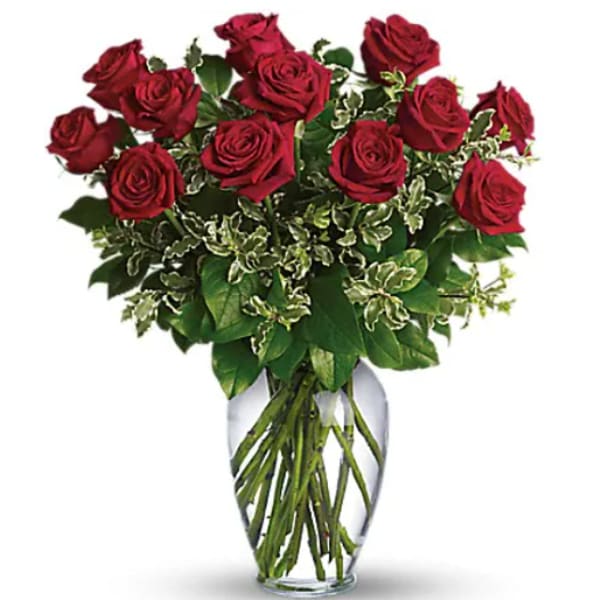 Bouquet of red roses in a clear glass vase