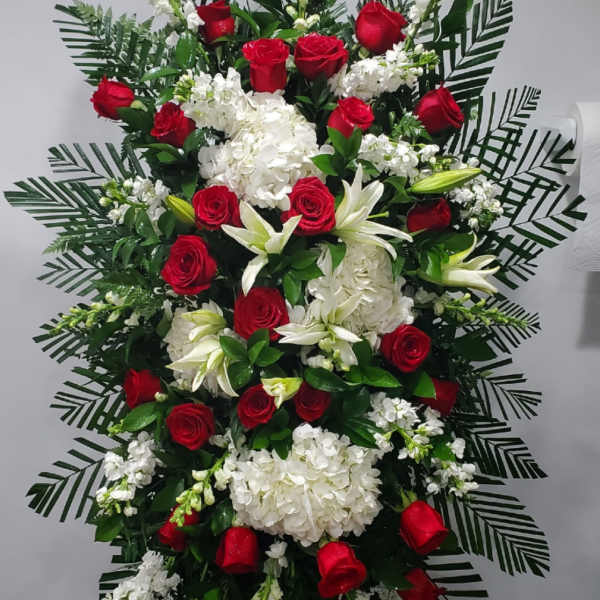 Standing floral spray with red roses and white blooms
