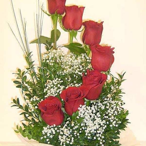 Bouquet of red roses with baby's breath and greenery