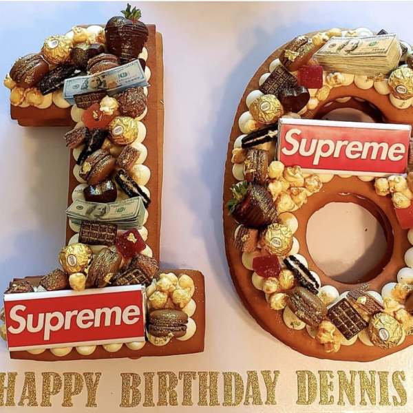 Number 18 birthday display decorated with candy and cash