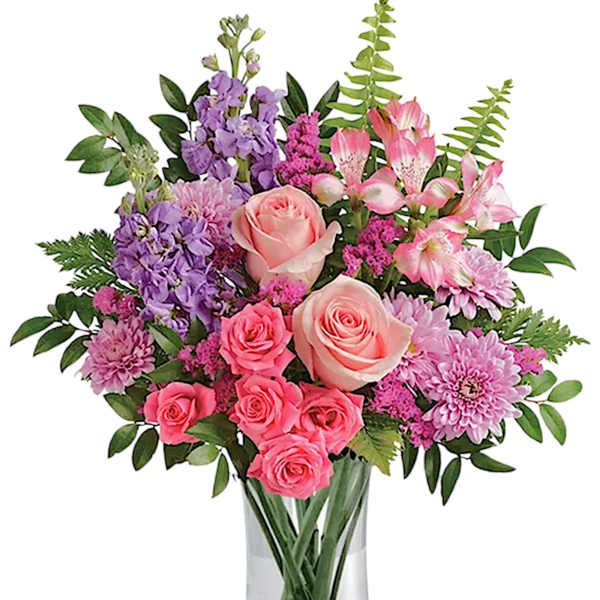 Pink and purple mixed bouquet in a clear glass vase
