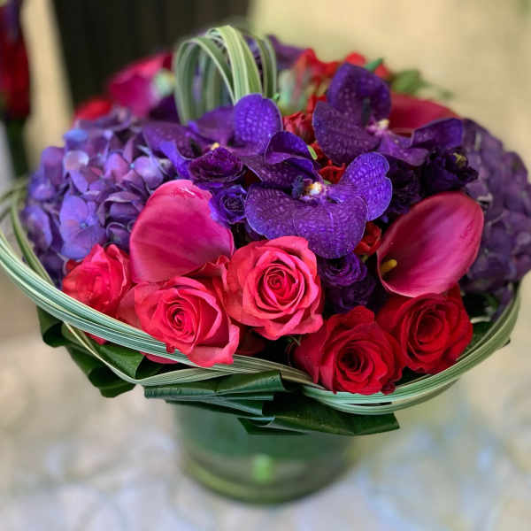Bouquet of pink and purple flowers in a glass vase
