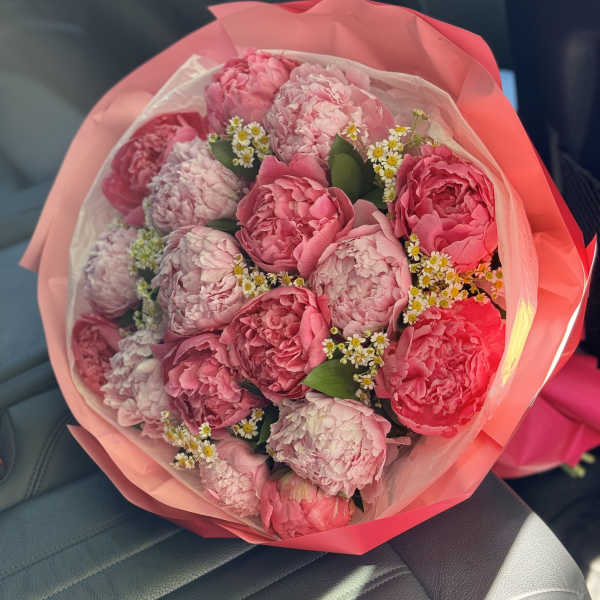 Gorgeous Bouquet With Peonies And Chamomile. The photo shows a deluxe size.
