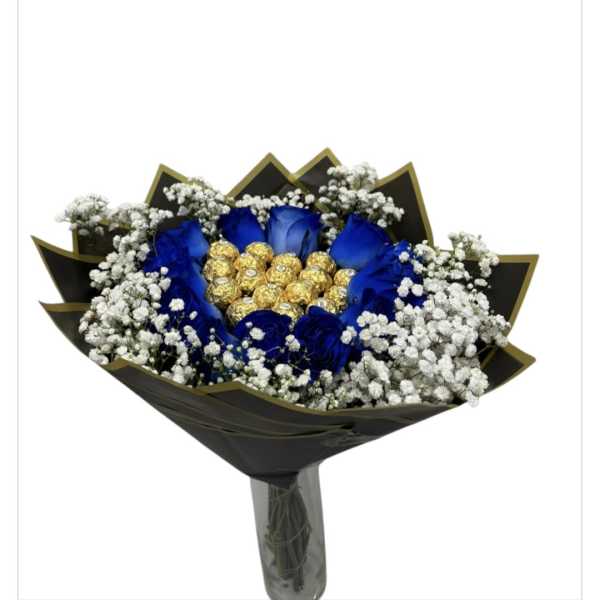 Blue roses with white baby's breath and gold-wrapped chocolates in black wrap