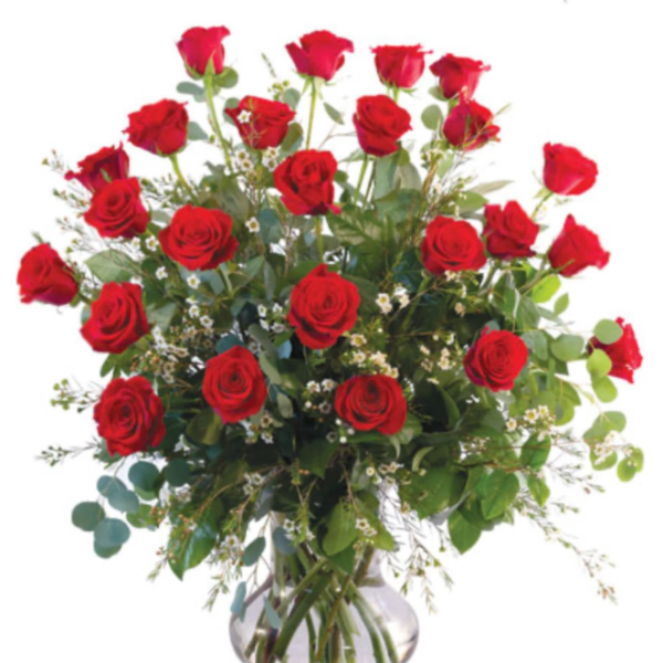 Red roses arranged in a clear glass vase